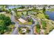 Aerial view of community amenities including tennis courts and lake at 1535 Harlow Ct., Myrtle Beach, SC 29579
