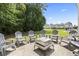 Outdoor patio seating with firepit and lawn at 1535 Harlow Ct., Myrtle Beach, SC 29579