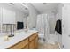 Functional bathroom with a shower-tub combo, tile flooring, and a wooden vanity at 1535 Harlow Ct., Myrtle Beach, SC 29579