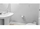 Bright bathroom featuring a pedestal sink with modern fixtures and neutral decor at 1535 Harlow Ct., Myrtle Beach, SC 29579