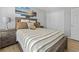 Comfortable bedroom with wood-look flooring, a large closet, and a decorative headboard at 1535 Harlow Ct., Myrtle Beach, SC 29579