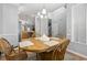 Dining room with wooden table and chairs next to the kitchen with natural light at 1535 Harlow Ct., Myrtle Beach, SC 29579