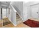 Bright foyer with hardwood flooring that leads to the carpeted staircase, enhanced by fresh paint at 1535 Harlow Ct., Myrtle Beach, SC 29579