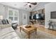 Bright living room featuring hardwood floors, vaulted ceilings, and comfortable seating with lots of natural light at 1535 Harlow Ct., Myrtle Beach, SC 29579