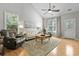 Bright living room featuring hardwood floors, vaulted ceilings, and comfortable seating with lots of natural light at 1535 Harlow Ct., Myrtle Beach, SC 29579