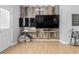 Cozy room with unique wooden paneling, multiple TVs, and stylish décor that adds character at 1535 Harlow Ct., Myrtle Beach, SC 29579