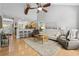 Open-concept living room with hardwood floors and seamless flow into the kitchen, perfect for entertaining at 1535 Harlow Ct., Myrtle Beach, SC 29579