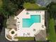Aerial view of a community pool with ample seating and sunbathing areas at 1635 Southwood Dr., Surfside Beach, SC 29575