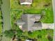 Aerial view of property with lush greenery and pond, showcasing its serene setting at 1635 Southwood Dr., Surfside Beach, SC 29575