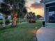 Picturesque backyard featuring lush landscaping, pond views, and an inviting patio area at 1635 Southwood Dr., Surfside Beach, SC 29575