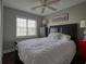 Comfortable bedroom with a black leather headboard, ceiling fan, and natural light at 1635 Southwood Dr., Surfside Beach, SC 29575