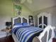 Bright bedroom with vaulted ceiling, hardwood flooring, and custom furnishings at 1635 Southwood Dr., Surfside Beach, SC 29575