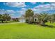 Charming home with lush lawn and mature palms offers curb appeal at 1635 Southwood Dr., Surfside Beach, SC 29575