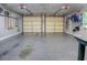 Spacious two car garage with shelving and lighting offers ample storage and parking at 1635 Southwood Dr., Surfside Beach, SC 29575