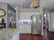 Bright kitchen featuring granite countertops, stainless appliances, and custom cabinets for ample storage space at 1635 Southwood Dr., Surfside Beach, SC 29575