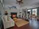 Cozy living room boasts a fireplace, high ceilings, dark wood floors and stylish nautical decor at 1635 Southwood Dr., Surfside Beach, SC 29575