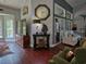 Open concept living space featuring hardwood floors, neutral decor, and large windows providing ample natural light at 1635 Southwood Dr., Surfside Beach, SC 29575