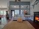 Inviting living room features a jute rug, comfortable sofa, fireplace and high ceilings at 1635 Southwood Dr., Surfside Beach, SC 29575