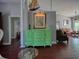 Stylish room with a painting and green cabinet with views to two separate rooms at 1635 Southwood Dr., Surfside Beach, SC 29575