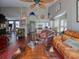 A spacious living room featuring hardwood floors and comfortable leather furniture under a high ceiling with nautical decor at 1635 Southwood Dr., Surfside Beach, SC 29575