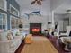 Cozy living room boasts a fireplace, high ceilings, dark wood floors and stylish nautical decor at 1635 Southwood Dr., Surfside Beach, SC 29575