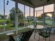 Inviting screened porch with peaceful water views offers serene outdoor living at 1635 Southwood Dr., Surfside Beach, SC 29575