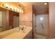 Bathroom featuring a large mirror, modern vanity, and a shower-tub combo at 1690 N Waccamaw Dr. # 504, Garden City Beach, SC 29576