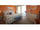 Bright bedroom with a king bed, dresser, and sliding doors to the balcony at 1690 N Waccamaw Dr. # 504, Garden City Beach, SC 29576