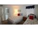 Comfortable bedroom featuring two twin beds with stylish bedding and a relaxing ambiance at 1690 N Waccamaw Dr. # 504, Garden City Beach, SC 29576