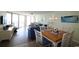 Bright condo living room featuring ocean views, comfortable seating and a dining area with seating for four at 1690 N Waccamaw Dr. # 504, Garden City Beach, SC 29576