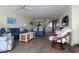 Bright living room featuring two sofas, stylish chairs, and an open floor plan at 1690 N Waccamaw Dr. # 504, Garden City Beach, SC 29576