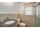 Bathroom featuring a decorative sink, toilet, and shower with neutral colored walls at 1700 Longleaf Dr., Myrtle Beach, SC 29575