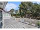 Enjoy outdoor living on this home's deck, surrounded by a yard and mature trees at 1700 Longleaf Dr., Myrtle Beach, SC 29575
