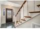 Welcoming foyer features a decorative glass front door, marble floors, and an elegant staircase at 1700 Longleaf Dr., Myrtle Beach, SC 29575