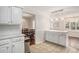 Eat-in kitchen features white cabinets, stainless steel appliances, and marble countertops at 1700 Longleaf Dr., Myrtle Beach, SC 29575