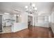 Open concept living space with hardwood floors, white trim and access to the kitchen at 1700 Longleaf Dr., Myrtle Beach, SC 29575