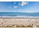 A serene beach view featuring beachgoers enjoying the calming ocean waves and sunny weather at 201 74Th Ave N Ocean Blvd. # 2627, Myrtle Beach, SC 29572