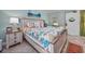 Beautiful bedroom with a coastal-themed queen bed, side tables, and tasteful beach decor at 201 74Th Ave N Ocean Blvd. # 2627, Myrtle Beach, SC 29572