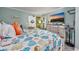 Relaxing bedroom with a coastal-themed bed, television, and dresser for ample storage at 201 74Th Ave N Ocean Blvd. # 2627, Myrtle Beach, SC 29572