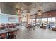 Spacious dining area with ceiling fans, tin ceilings, large windows, and ocean views at 201 74Th Ave N Ocean Blvd. # 2627, Myrtle Beach, SC 29572