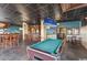 Entertainment area with a pool table, bar, televisions, and eclectic decor at 201 74Th Ave N Ocean Blvd. # 2627, Myrtle Beach, SC 29572