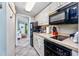 Efficient kitchenette with essential appliances, seamlessly connects to the living area for easy living at 201 74Th Ave N Ocean Blvd. # 2627, Myrtle Beach, SC 29572
