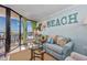 Stylish living room offering a cozy seating area and scenic balcony access with ocean views at 201 74Th Ave N Ocean Blvd. # 2627, Myrtle Beach, SC 29572