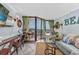 Comfortable living space with a desk, balcony access, and decorative beach accents at 201 74Th Ave N Ocean Blvd. # 2627, Myrtle Beach, SC 29572
