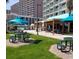 Grassy outdoor dining area with picnic tables and seating near the Dunes building at 201 74Th Ave N Ocean Blvd. # 2627, Myrtle Beach, SC 29572