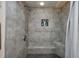Modern tiled shower with a shower head, a built-in seat, and a shampoo nook at 201 74Th Ave N Ocean Blvd. # 2627, Myrtle Beach, SC 29572