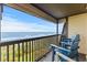 Oceanfront balcony with chairs, perfect for relaxing and enjoying the beautiful beach and ocean views at 201 76Th Ave. N # D-3, Myrtle Beach, SC 29572