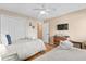 Relaxing bedroom featuring two twin beds, wood floors, ceiling fan, and closet at 201 76Th Ave. N # D-3, Myrtle Beach, SC 29572