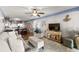 Open-concept living area with modern furnishings and a view into the adjacent kitchen at 201 76Th Ave. N # D-3, Myrtle Beach, SC 29572