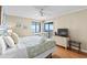 Comfortable bedroom features a ceiling fan, and a sliding glass door providing access to the balcony and an ocean view at 201 76Th Ave. N # D-3, Myrtle Beach, SC 29572